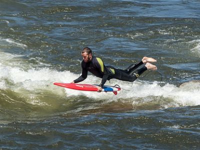 man surfing brennans wave in missoula