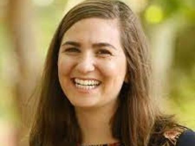 Allison smiles at the camera