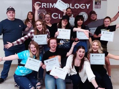 Students attended the Student Law Enforcement Academy and are holding their earned awards.