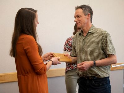 eva handing a wood sustainability award to Christopher Preston