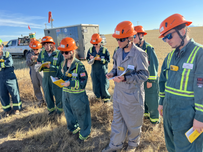 students in the field working with Well Done to cap an orphan well in Eastern Montana