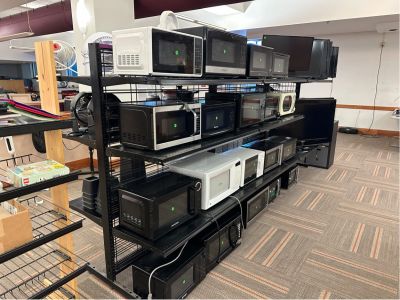 row of microwaves on display