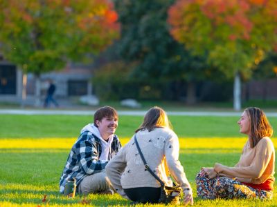 students sitting on the oval