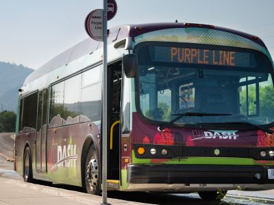 purple line bus stopped at stop on wyoming st