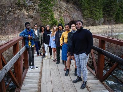 Black Student Union Members stand posed on a bridge