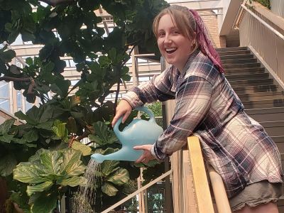 Garden student water plants from a staircase