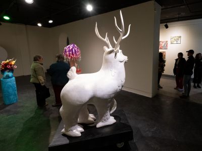 a sculpture of a deer inside the UC gallery