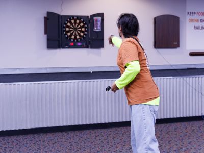 Man playing darts 