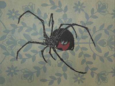 a print with a tan and grey lace background and a large black widow spider block-printed on top