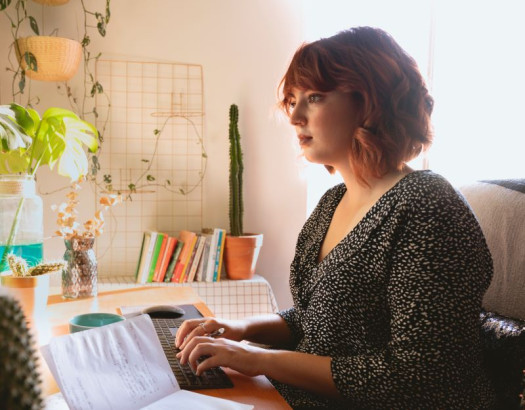 Woman typing on a laptop