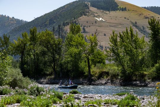 Raft with fisherman floating on the Clark Fork River