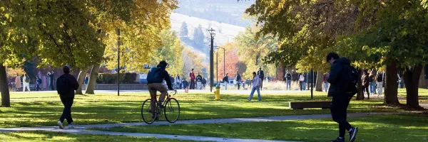 students make their way across the center of campus on a crisp fall day