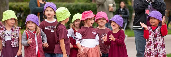 group of young children wearing UM colors