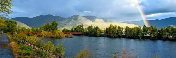 view from a river trail in Missoula showing Mt. Sentinel and a rainbow
