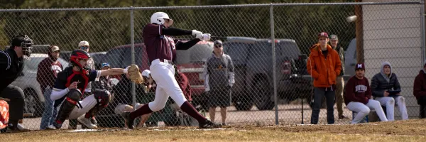 Griz baseball player swings at a pitch