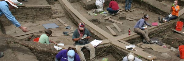 people busily working at an archaeological dig
