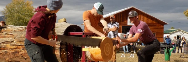 Members of UM Club Woodsman Team compete in a log-sawing competition