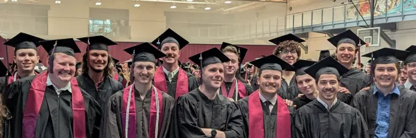 New graduates from UM's Computer Science Program pose for a picture.