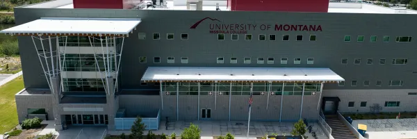 aerial view of Missoula College with the main entrance and sign in view