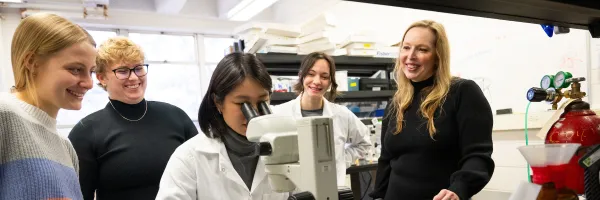 Beverly Piggott talks with her students in the lab at the University of Montana.