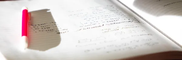 A pencil casts a long shadow across a notebook in a Physics 217 lab held in the Clapp Building on the �Թ��� campus in Missoula, MT.