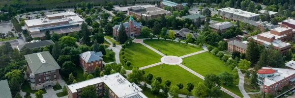 Aerial view of the University of Montana campus and buildings around UM's Oval in Missoula, MT.