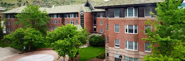 Pantzer Residence Hall main entrance and surrounding trees