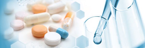 illustration with a variety of pills on the left and a pipette dripping liquid into a test tube on the right