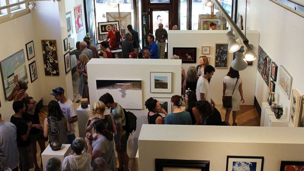 people gathering for an art show inside the Radius Gallery in Missoula, Montana