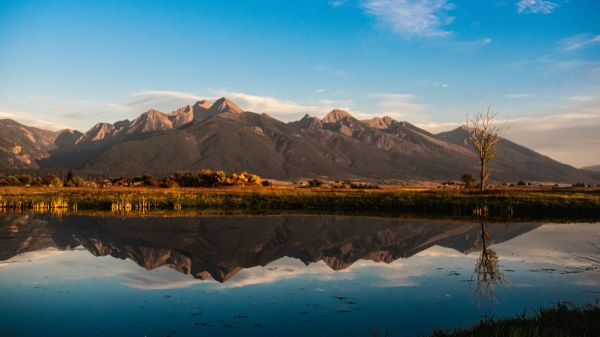 A photo of mountains overlooking a lake.