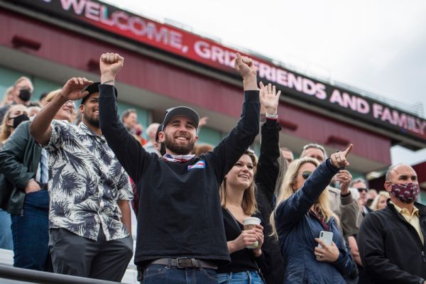 people cheering in stands at Griz football game