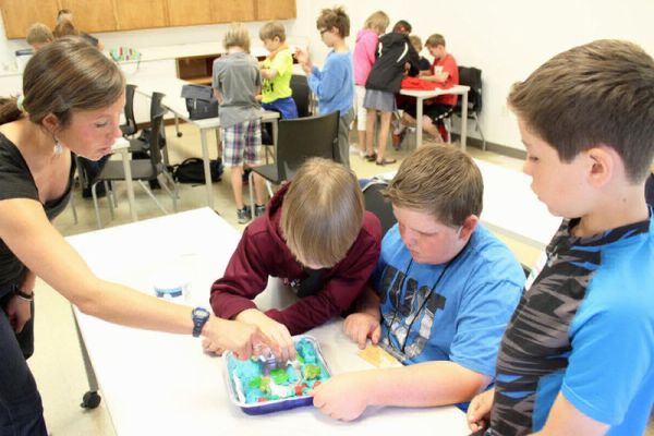 A role model guides students through an activity.