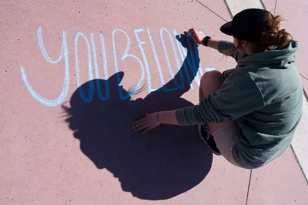 student drawing with chalk 