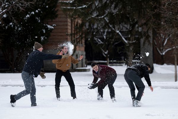 students having snowball fight