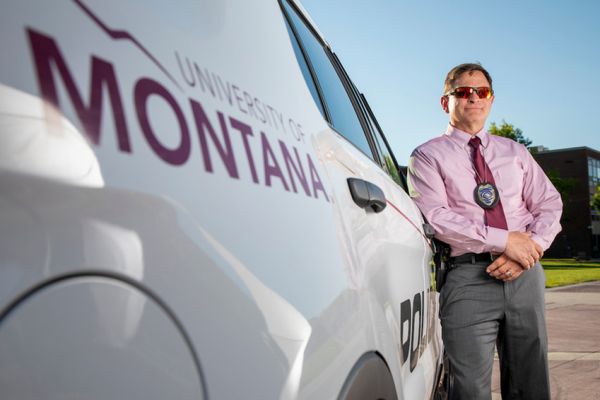 police chief standing in front of vehicle