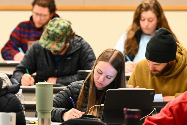 student writing in classroom 