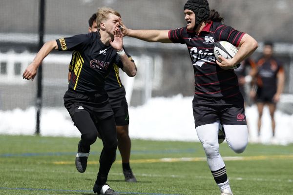 rugby player running with ball