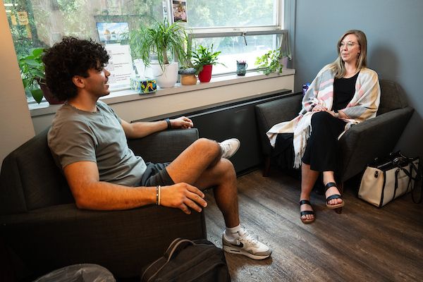 Two people in a therapy setting.