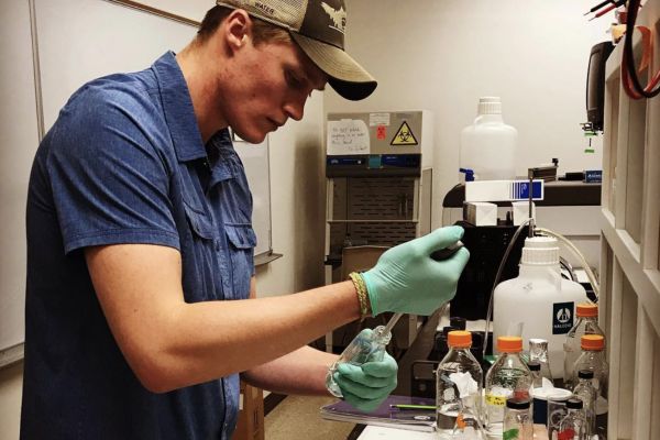 Colter Feuerstein working in a lab