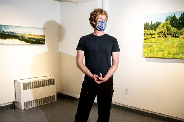 Eric Jensen in an art gallery with covid mask on
