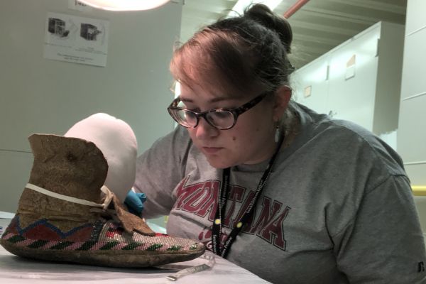Michaela Shifley working on a shoe