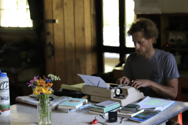 Rick White working with a typewriter