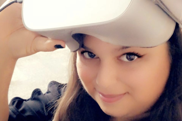 Kristina Mahagamage talking off VR headset