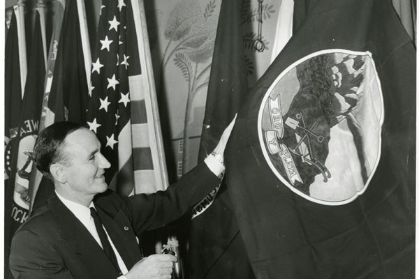 Mike Mansfield in front a Montana flag