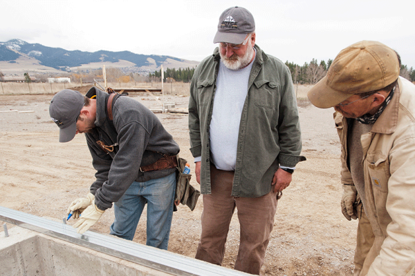 3 workers reviewing plans