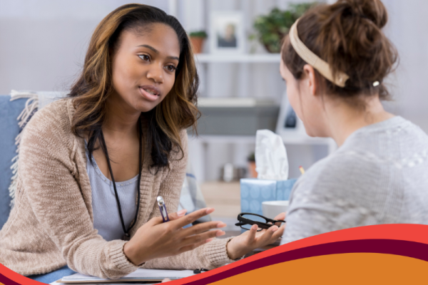 photo of counselor speaking with patient