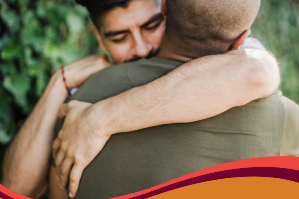 photo of two men hugging