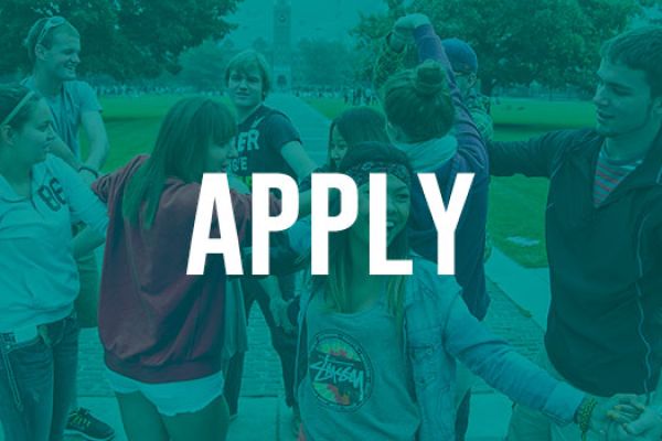 A blue-tinted image of students holding hands