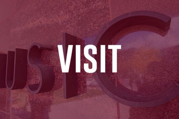 A maroon-tinted image of the Music Building