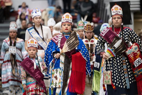 During grand entry, the Kyiyo powwow royalty lead the visiting royalty in grand entry